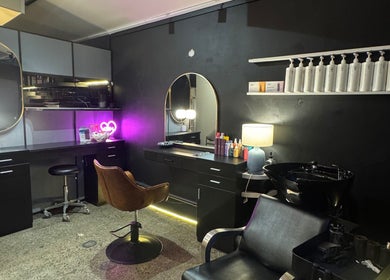 Stylish hair salon setup at Tanya J Hairstylist, Fortitude Valley, Queensland, AU with modern decor.