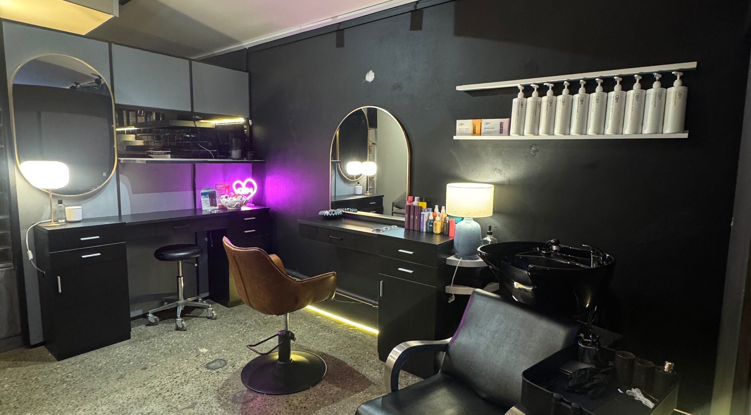 Stylish hair salon setup at Tanya J Hairstylist, Fortitude Valley, Queensland, AU with modern decor.