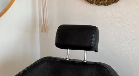Comfortable styling chair at Leah Marie Hairstylist in Bristol, England, GB, highlighting luxury salon experience.