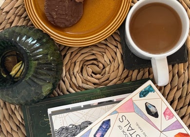 Relaxing table setup with coffee, snacks, and books at Leah Marie Hairstylist, Bristol, England, GB.