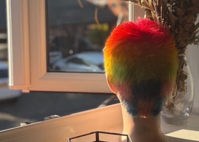 Vibrant rainbow hair color styled at Leah Marie Hairstylist, Bristol, England, GB.