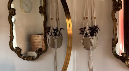 Elegant vintage mirrors and plant decor at Leah Marie Hairstylist, Bristol, England, GB.