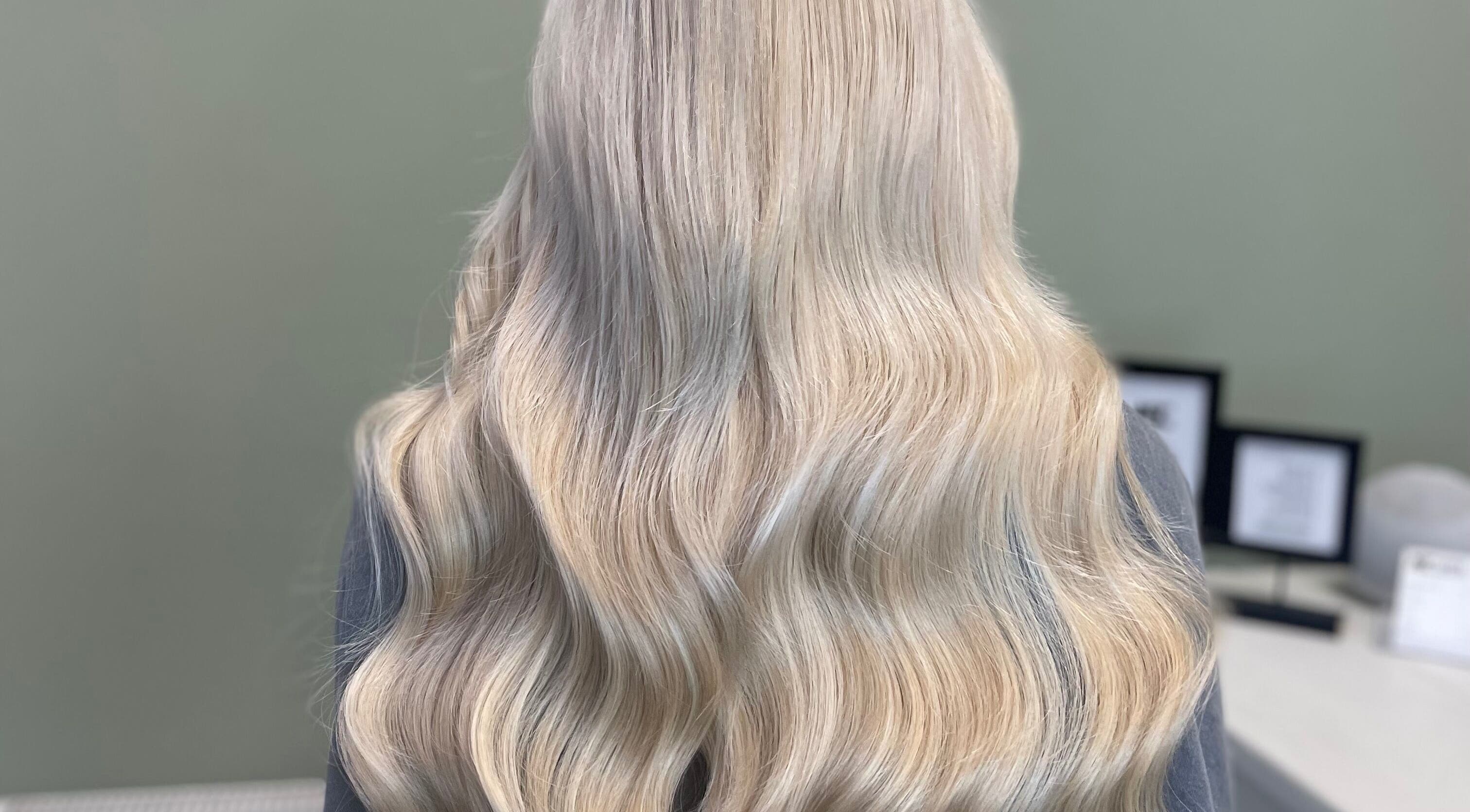 Blonde wavy hairstyle at Made.byellachambers in Kirkby In Ashfield, England, GB, showcasing salon's styling expertise.