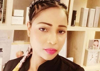 Experienced beautician at Touch & Beauty in Boksburg, Gauteng, ZA, showcasing skincare products.