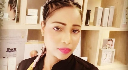 Experienced beautician at Touch & Beauty in Boksburg, Gauteng, ZA, showcasing skincare products.