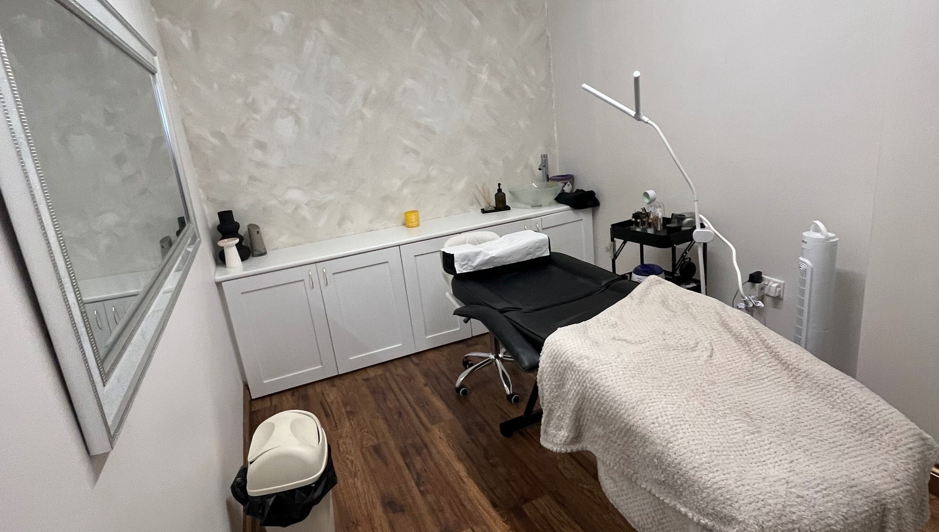Elegant beauty treatment room at Enhanced by mtb, Hull, England, GB, with modern decor and comfortable seating.