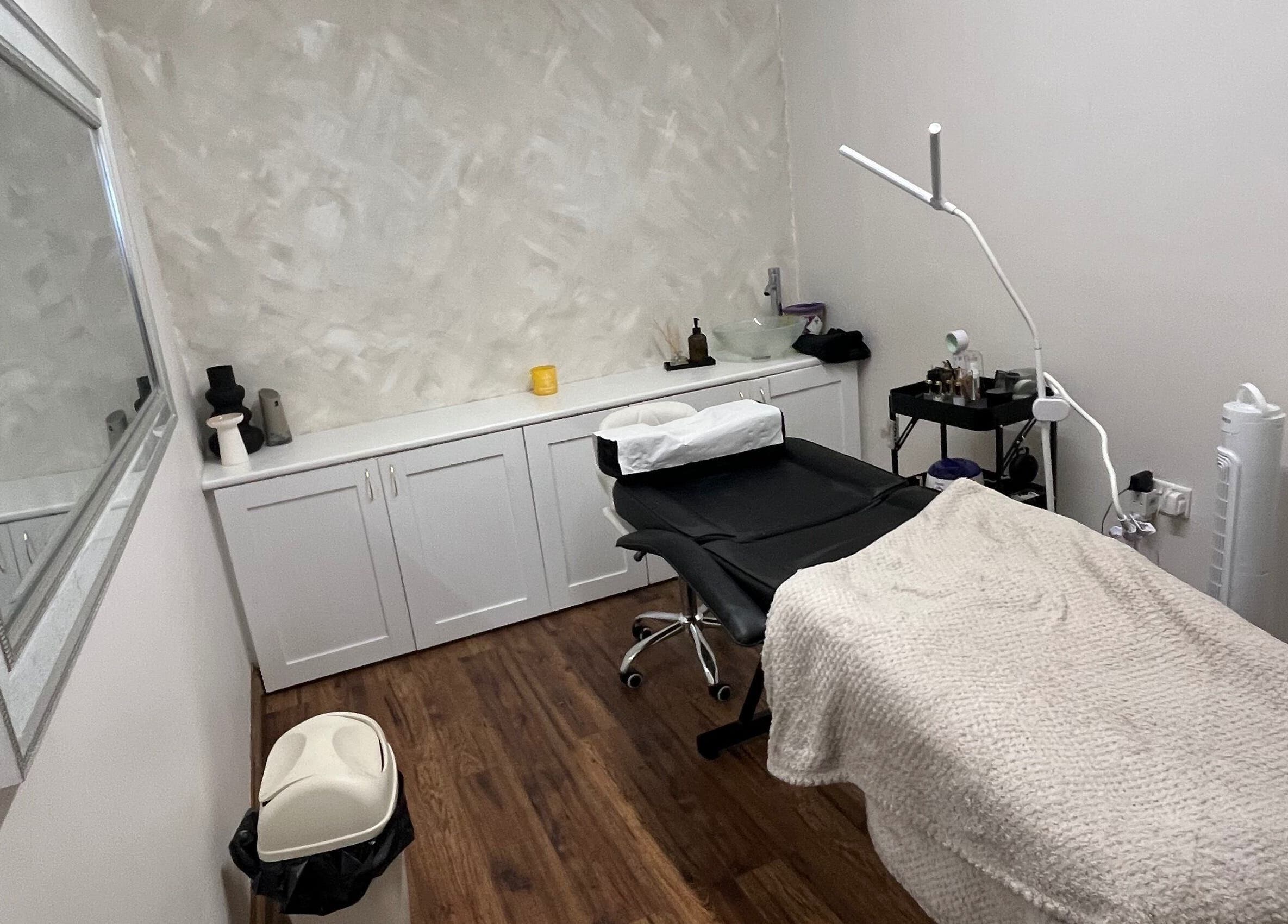 Elegant beauty treatment room at Enhanced by mtb, Hull, England, GB, with modern decor and comfortable seating.