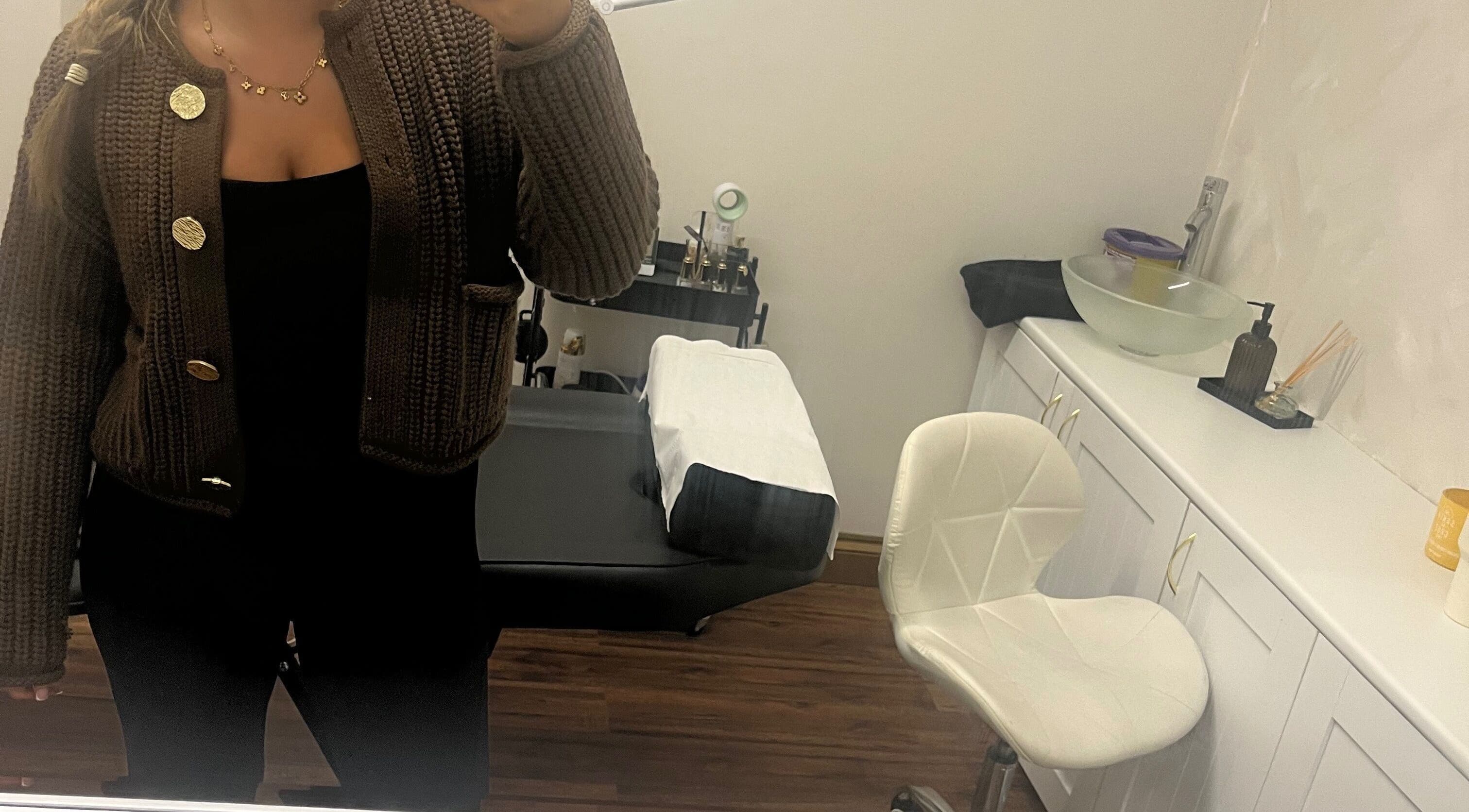 A comfortable treatment room at Enhanced by mtb in Hull, England, GB, featuring a chair and treatment bed.