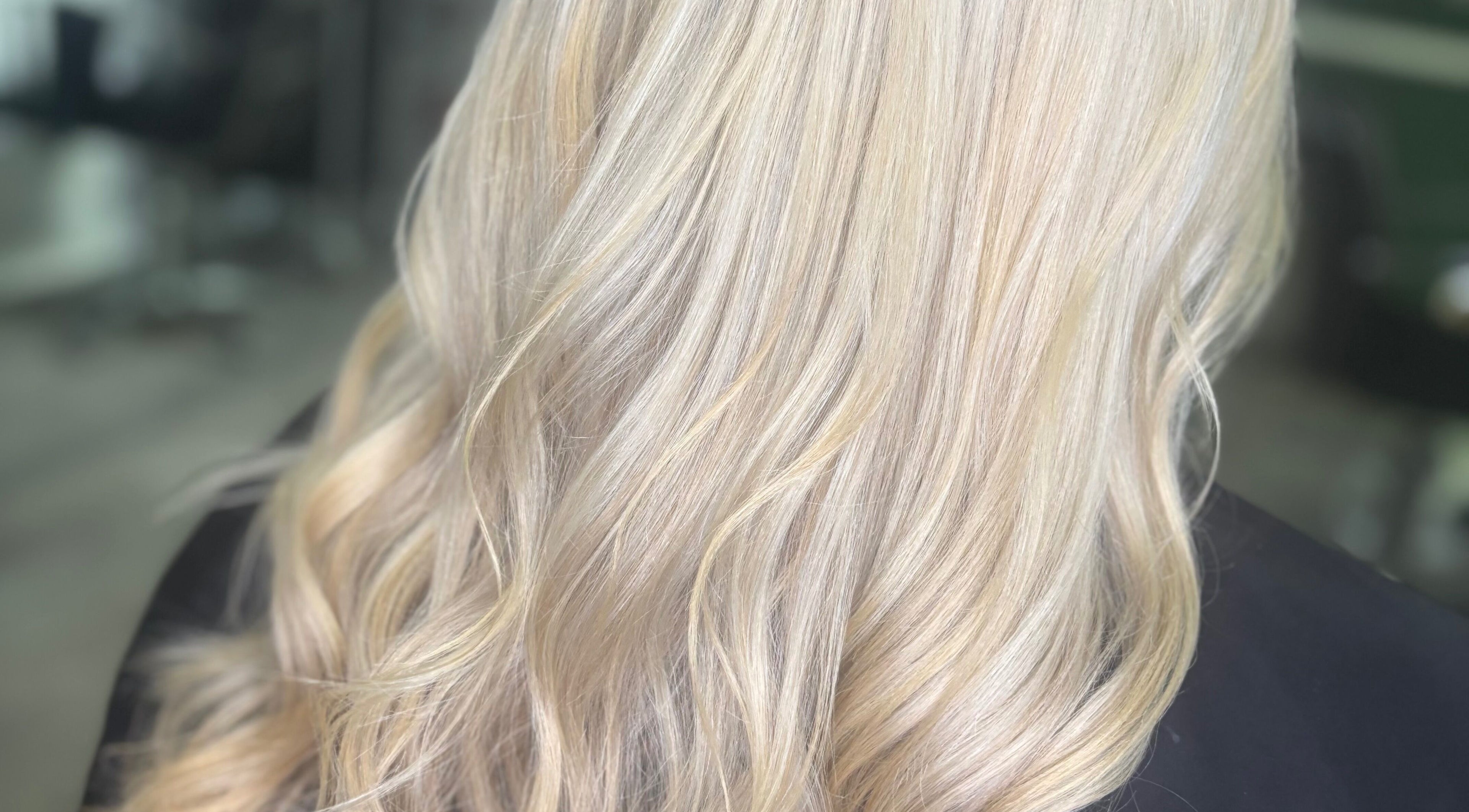 Elegant blonde waves styled at Cove Hair Beauty Wellness in Padstow, England, GB.
