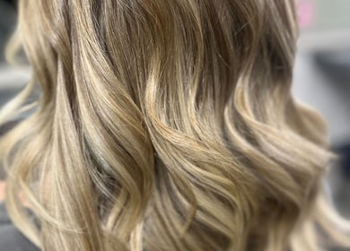 Stylish blonde waves hairstyle at Cove Hair Beauty Wellness, Padstow, England, GB.