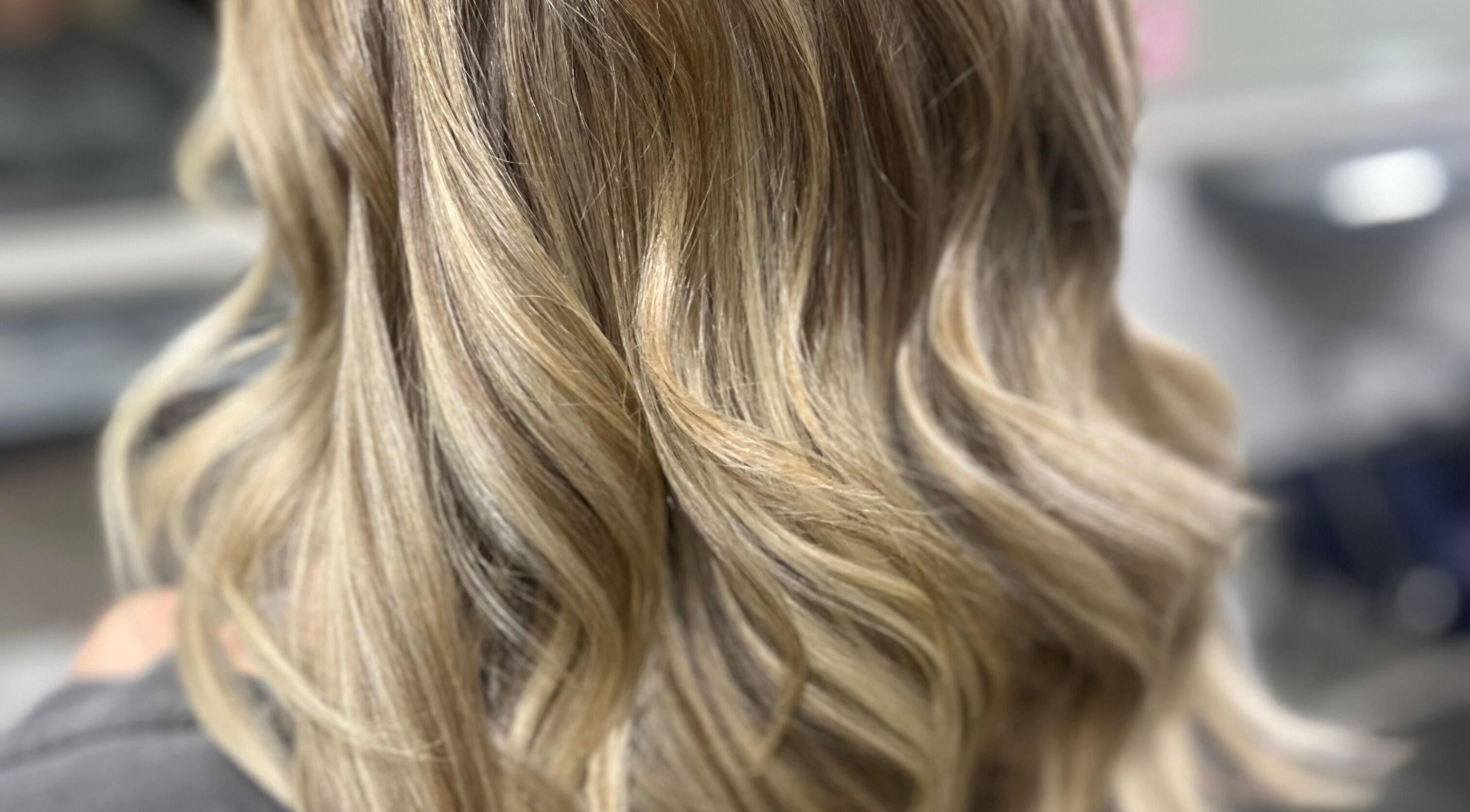 Stylish blonde waves hairstyle at Cove Hair Beauty Wellness, Padstow, England, GB.