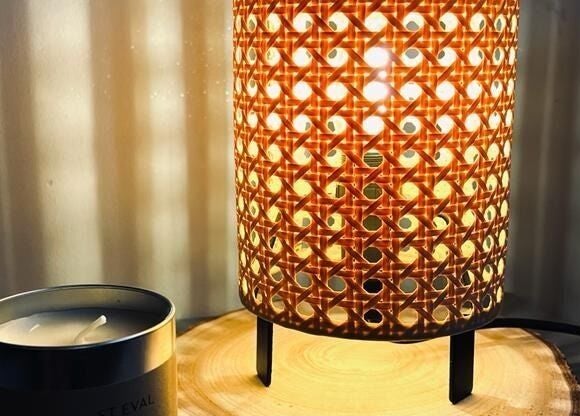 Cozy lamp and candle setup at Bare Essential Beauty in Addington, England, GB for a relaxing ambiance.