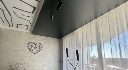 Stylish modern interior of EYESMILE ARTISTRY in Maroochydore, Queensland, AU with geometric heart wall decor.
