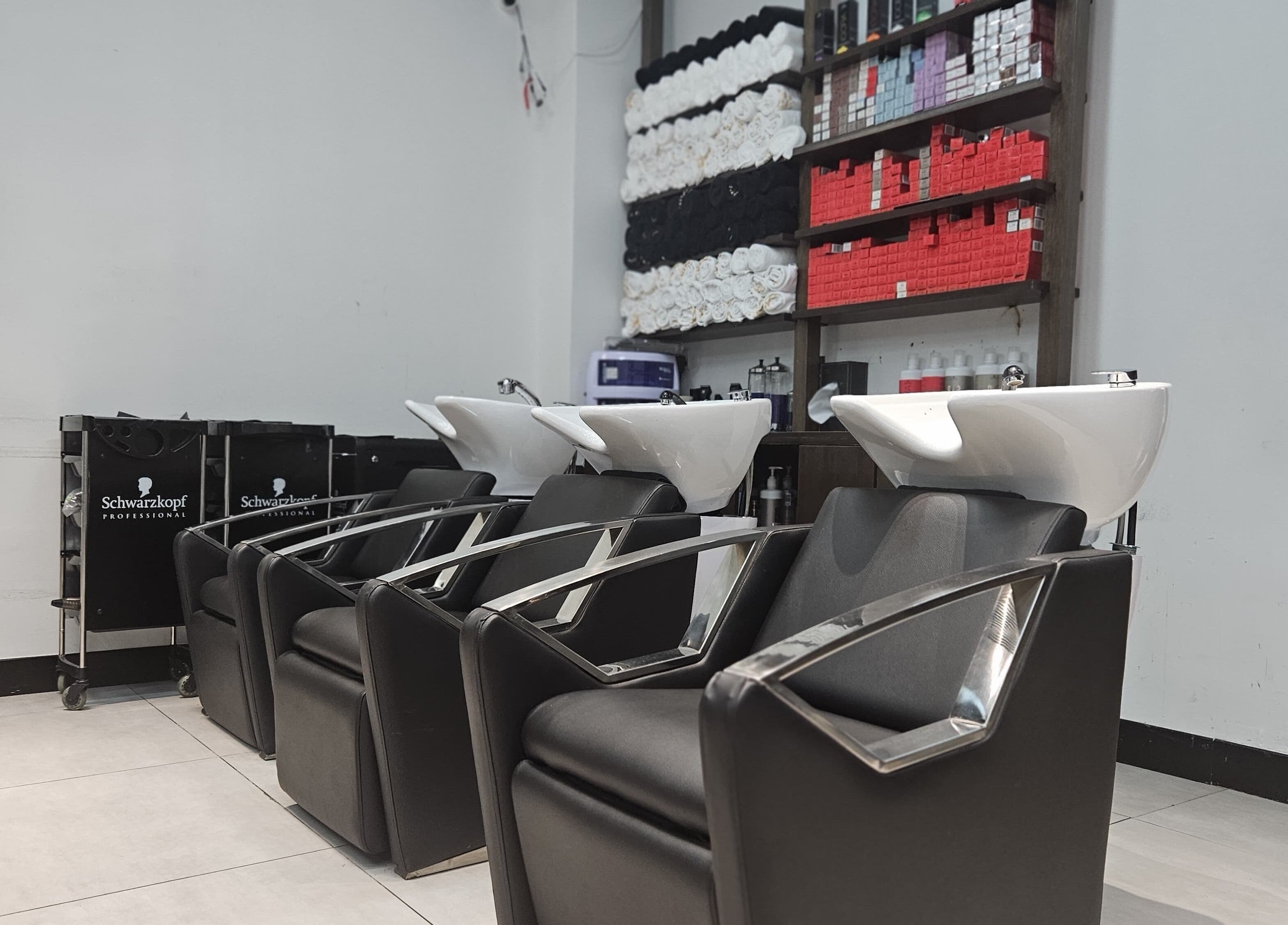 BB Salon Hair & Beauty wash station with sleek chairs in Dubai, Dubai, AE. Stylish and modern salon setup.