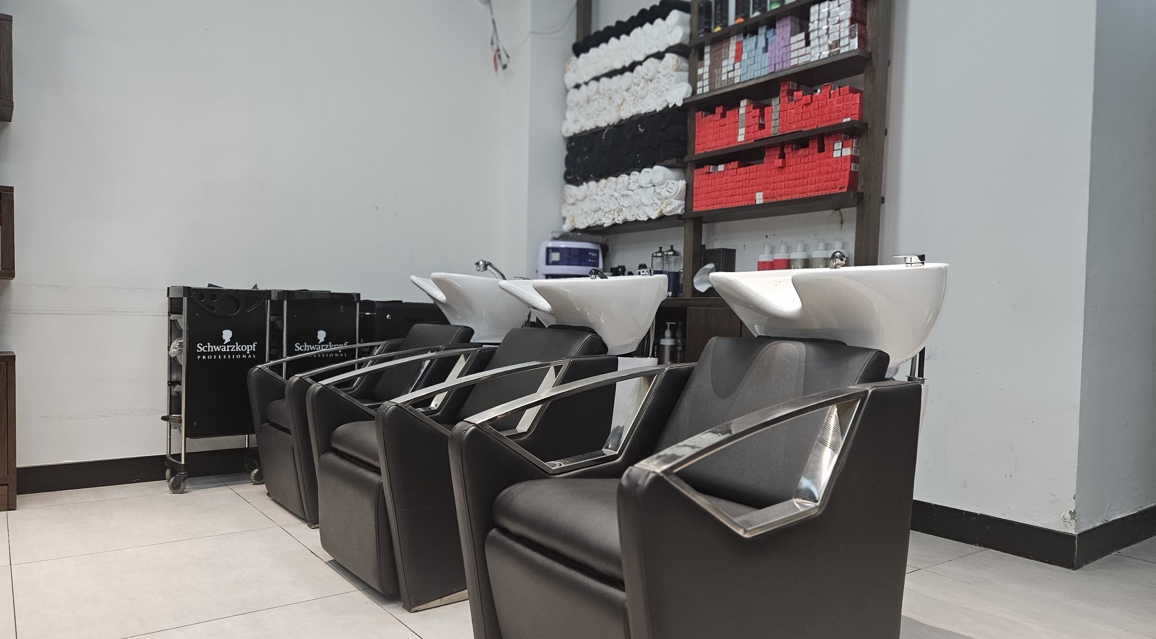 BB Salon Hair & Beauty wash station with sleek chairs in Dubai, Dubai, AE. Stylish and modern salon setup.