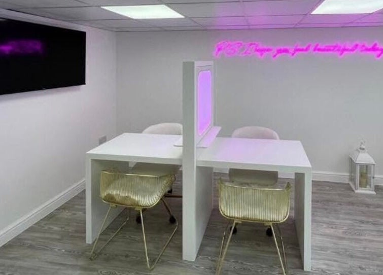 Modern workspace at Sass Aesthetics Training Academy, Milnrow, England, GB, featuring stylish seating and decor.