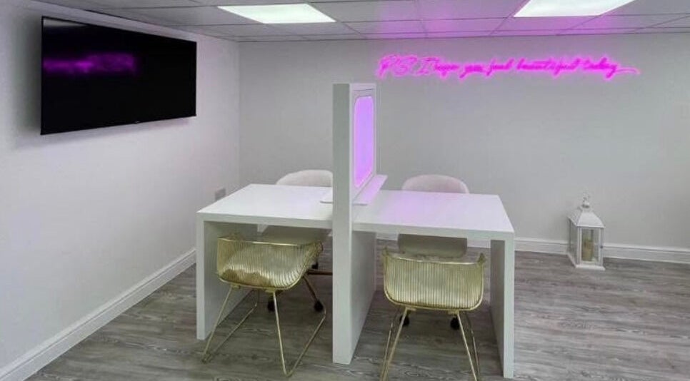 Modern workspace at Sass Aesthetics Training Academy, Milnrow, England, GB, featuring stylish seating and decor.
