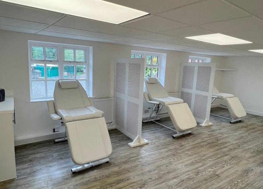 Calm treatment area at Sass Aesthetics Training Academy, Milnrow, England, GB, featuring reclining chairs.
