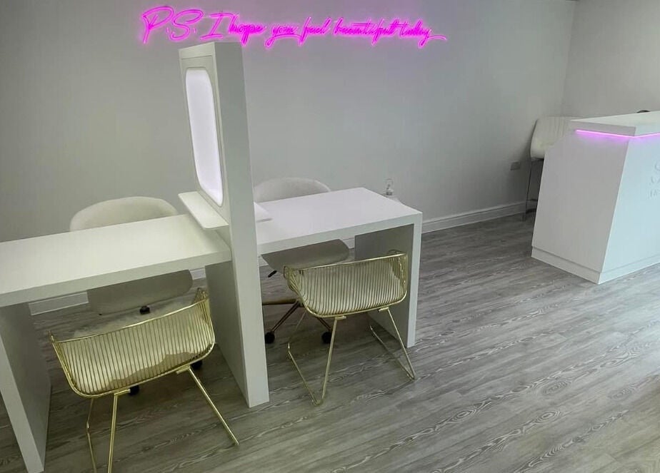 Chic interior of Sass Aesthetics Training Academy in Milnrow, England, GB, showcasing modern decor and luminous accents.