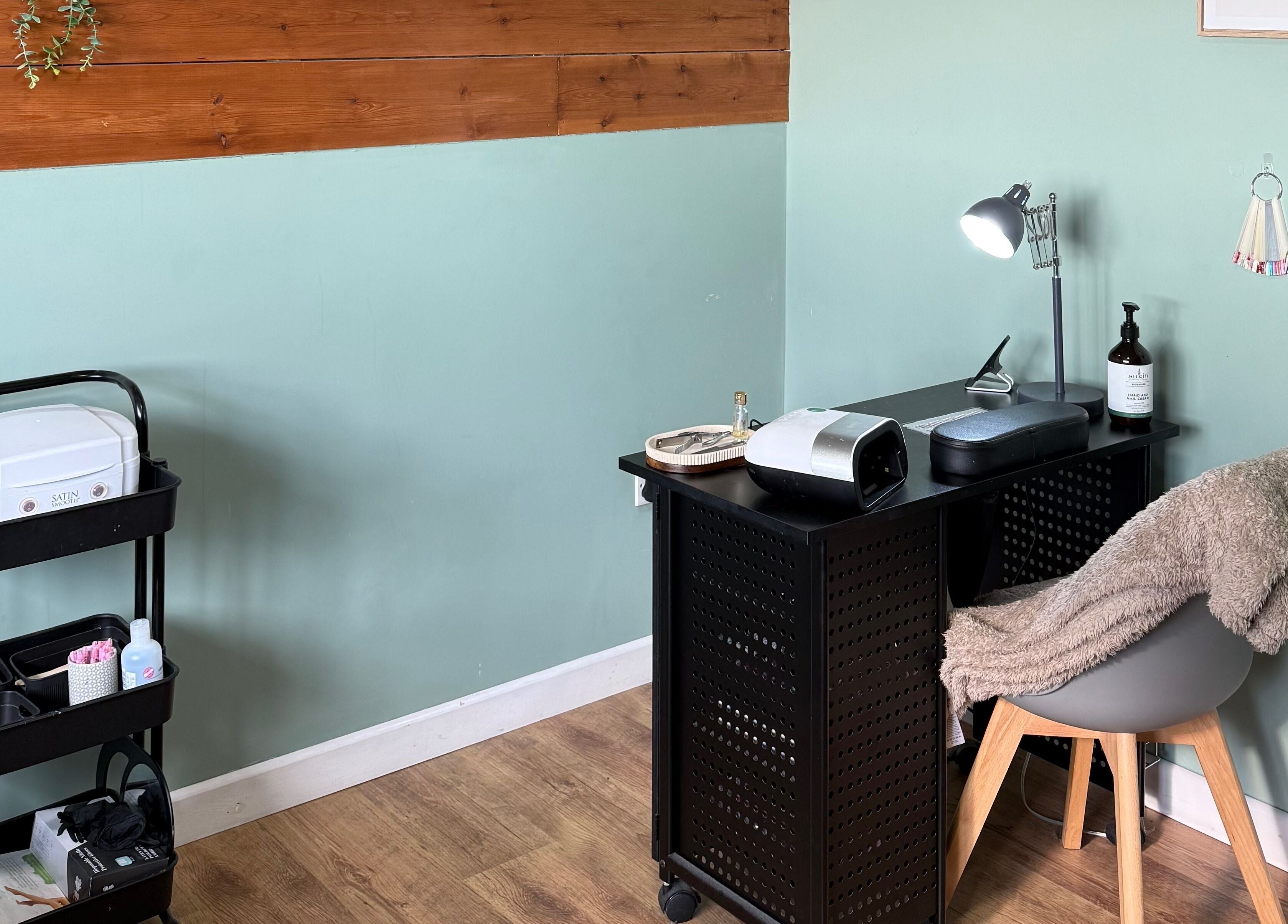 Elegant nail station at Libby’s Beauty in Welcombe, England, GB showcasing tools and decor.