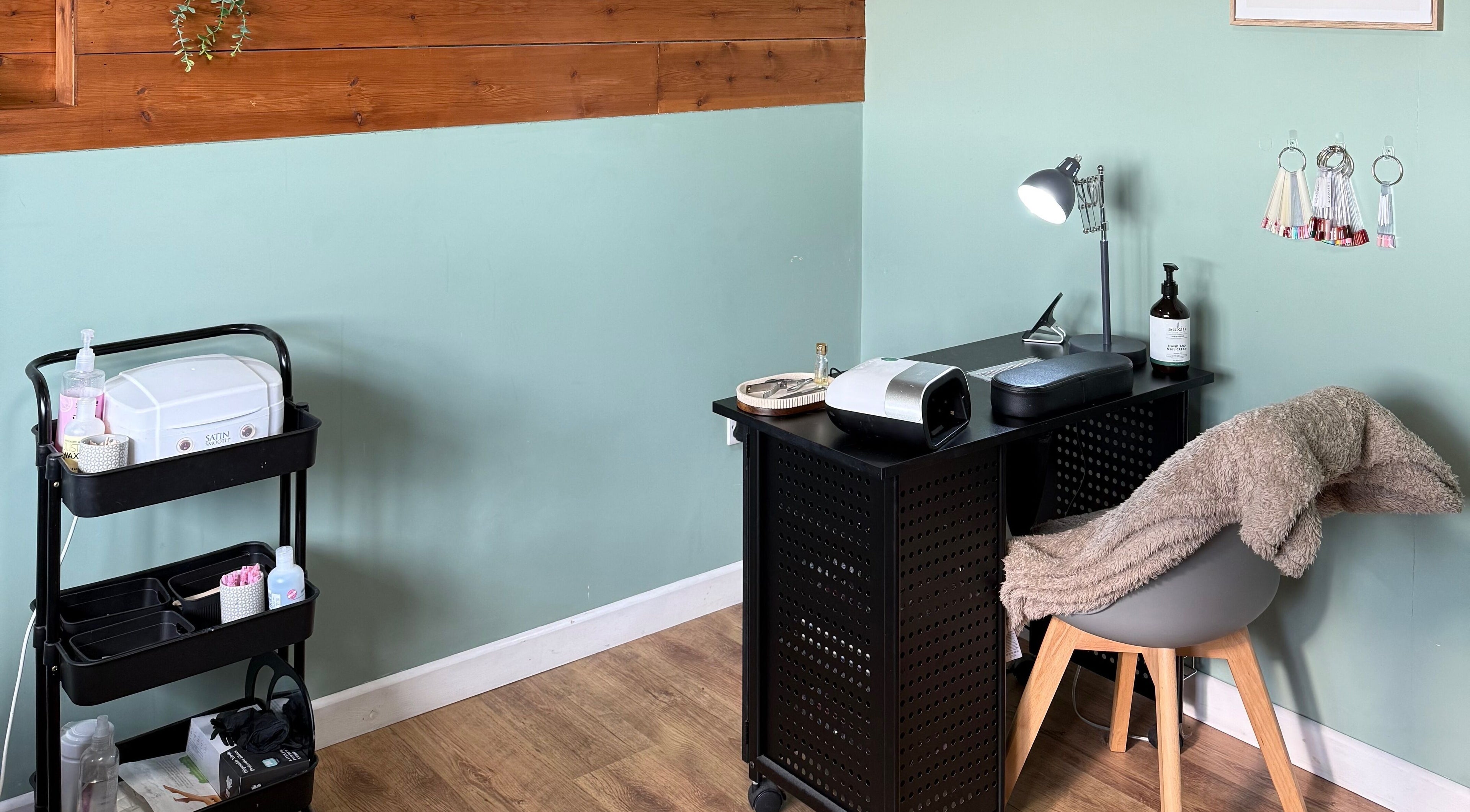 Elegant nail station at Libby’s Beauty in Welcombe, England, GB showcasing tools and decor.