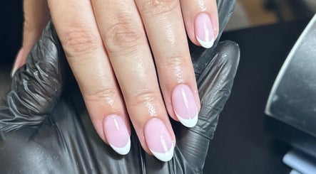 Beautiful French manicure at Libby’s Beauty in Welcombe, England, GB, showcasing glossy pink and white nails.