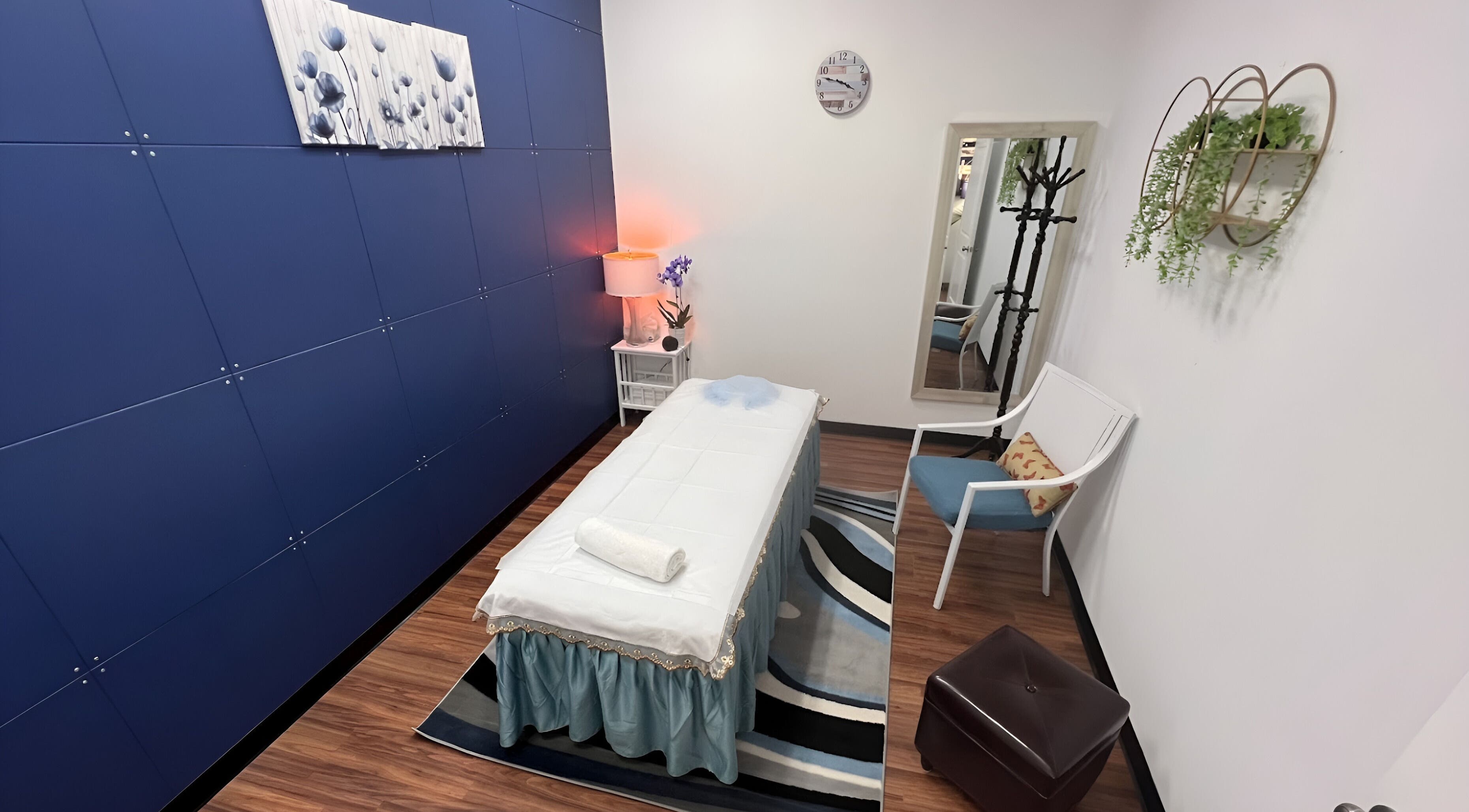 Calming treatment room at Moon Body Works in Bellingham, Massachusetts, US, featuring a massage table.