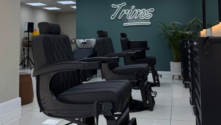Modern barber chairs at Bez Barber, Birmingham, England, GB, offering a sleek and comfortable grooming experience.