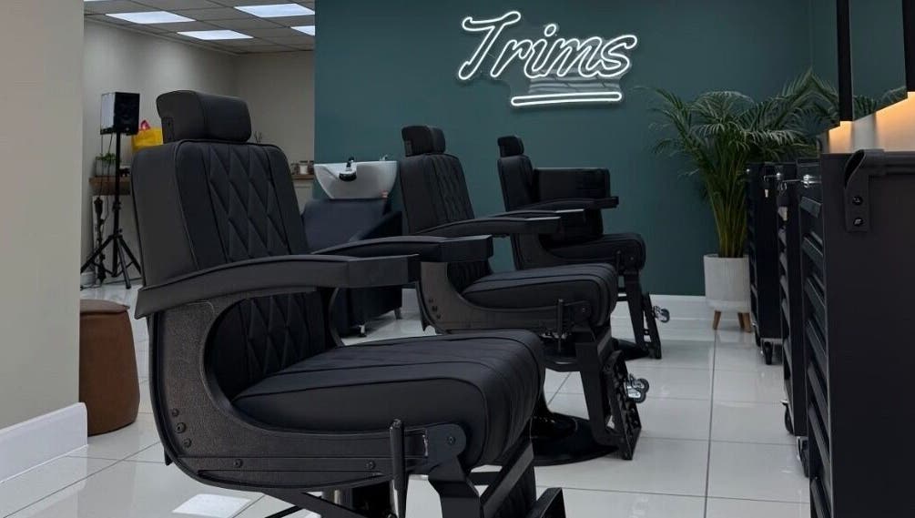 Modern barber chairs at Bez Barber, Birmingham, England, GB, offering a sleek and comfortable grooming experience.