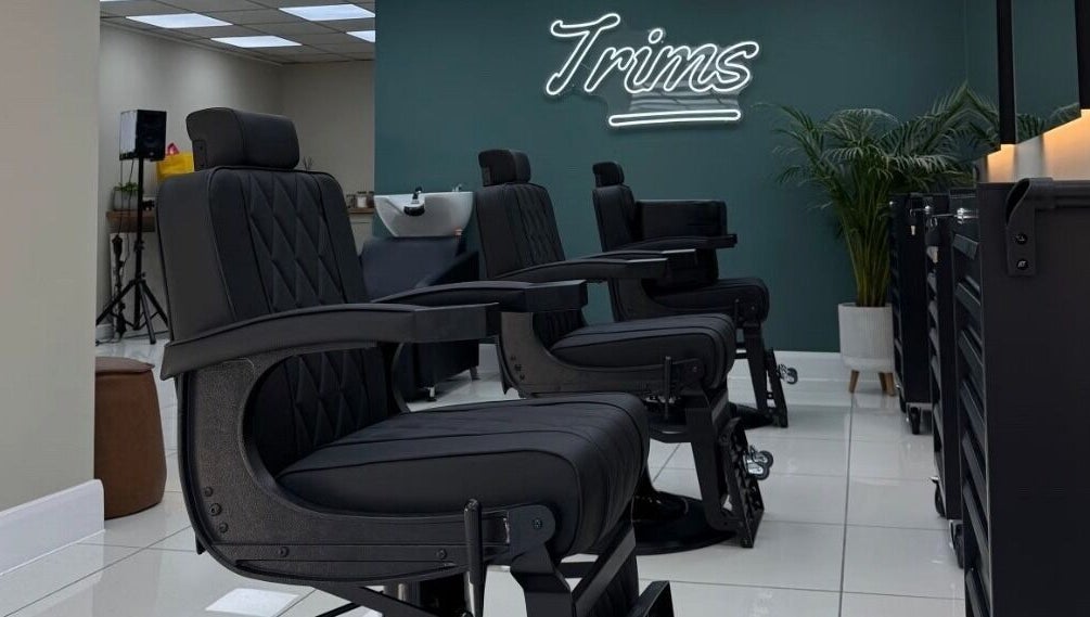 Modern barber chairs at Bez Barber, Birmingham, England, GB, offering a sleek and comfortable grooming experience.