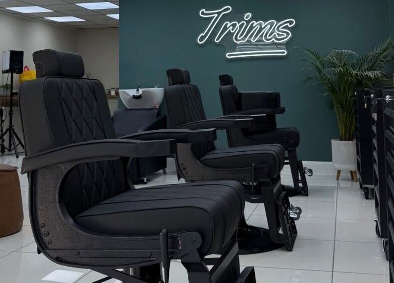 Modern barber chairs at Bez Barber, Birmingham, England, GB, offering a sleek and comfortable grooming experience.