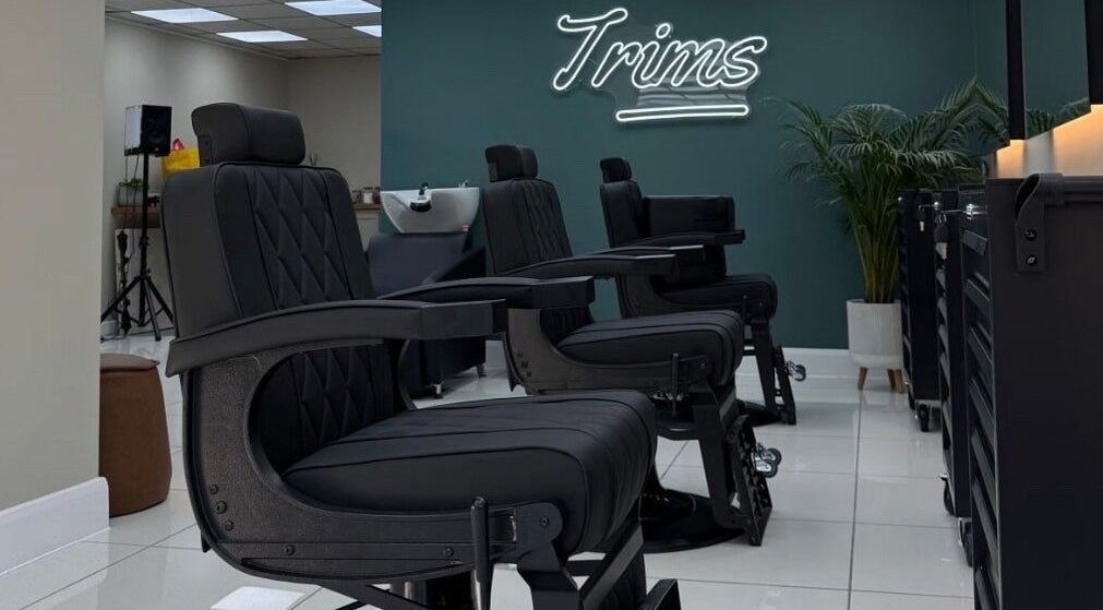 Modern barber chairs at Bez Barber, Birmingham, England, GB, offering a sleek and comfortable grooming experience.