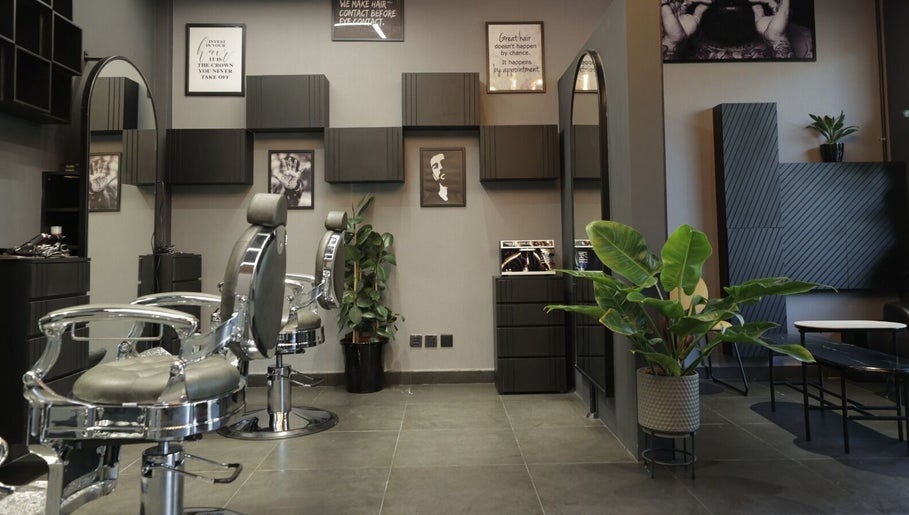 Sleek barber chairs and chic decor at Cutz Hair Studio in Riyadh, SA.