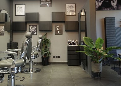 Sleek barber chairs and chic decor at Cutz Hair Studio in Riyadh, SA.