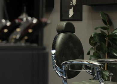 Elegant salon chair at Cutz Hair Studio, Riyadh, SA, highlighting modern style and comfort.