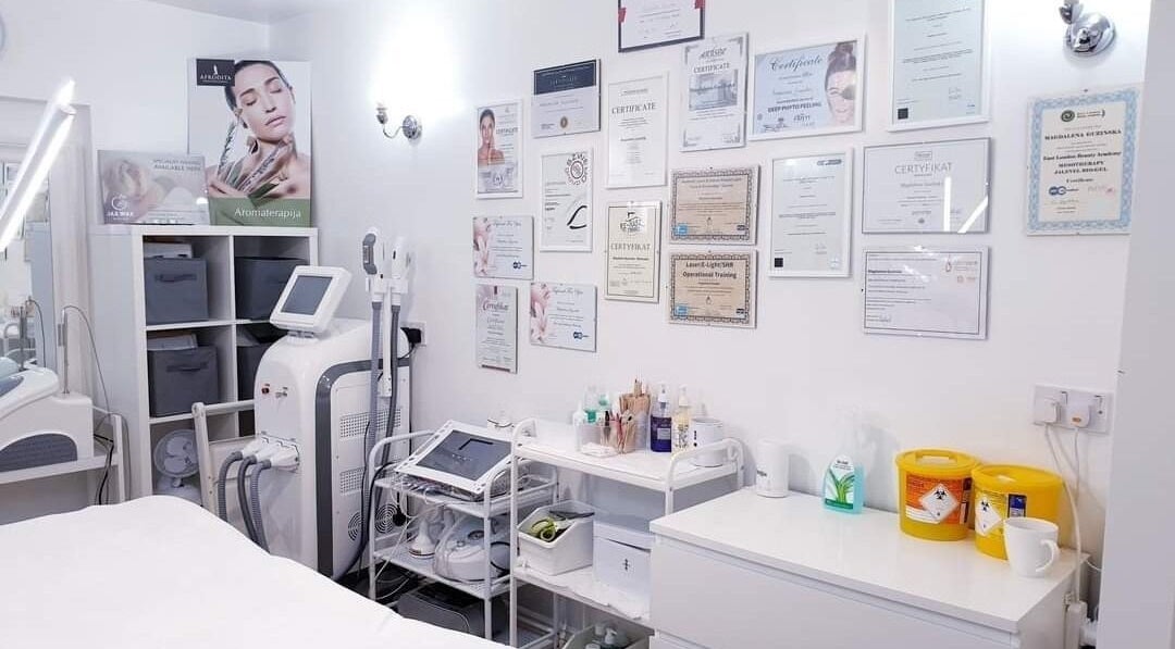 Treatment room at MG Institute of Beauty & Training Academy in Cheltenham, England. Certificates adorn the walls.