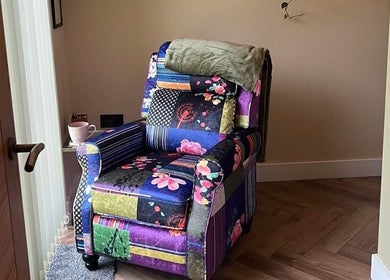 Colorful floral chair in cozy corner at Humblebee Wellness, Saint Leonards, England, GB.