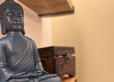 Blue Buddha statue at Humblebee Wellness, Saint Leonards, England, GB, promoting tranquility and wellness.