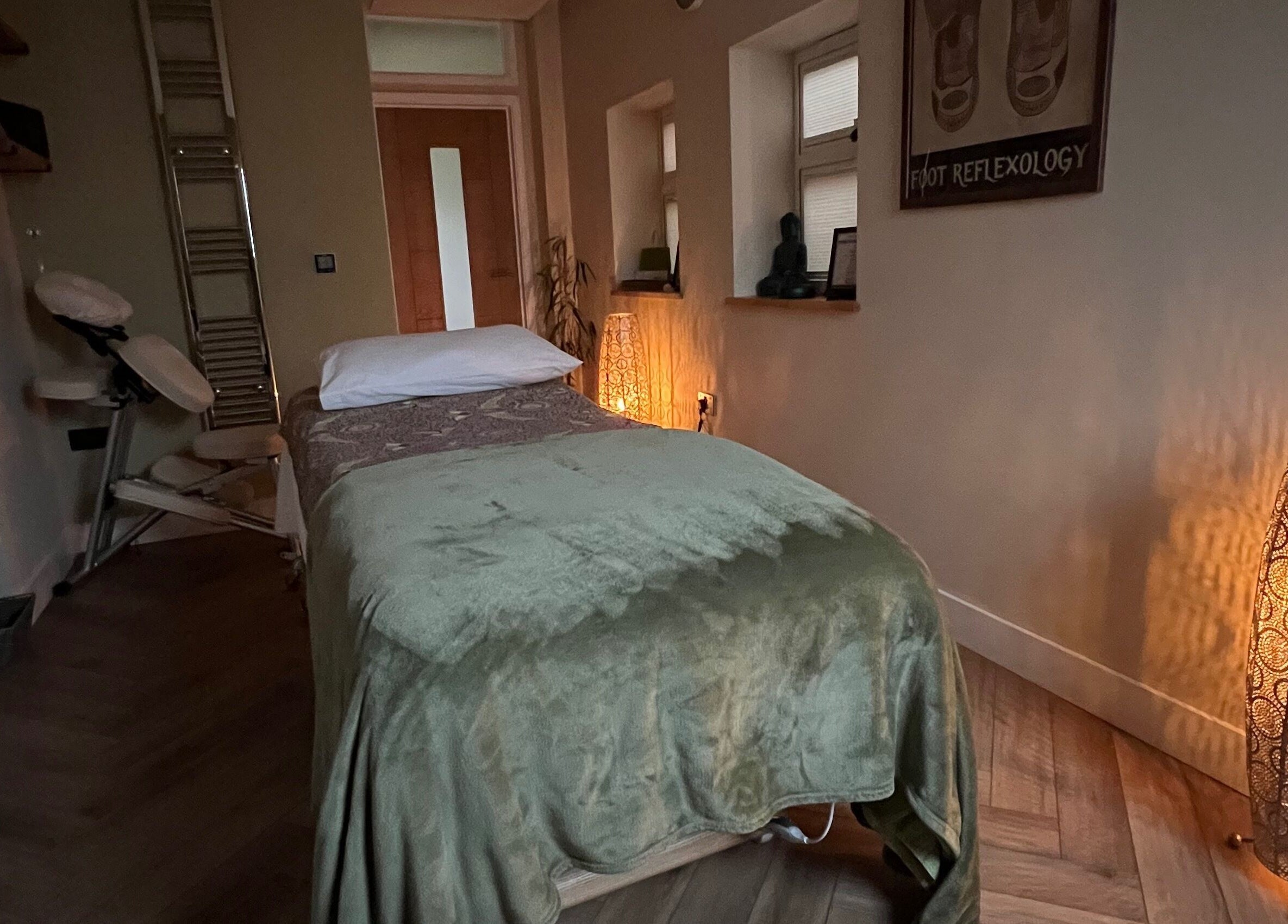 Tranquil treatment room at Humblebee Wellness, Saint Leonards, England, GB, featuring a massage table and soft lighting.