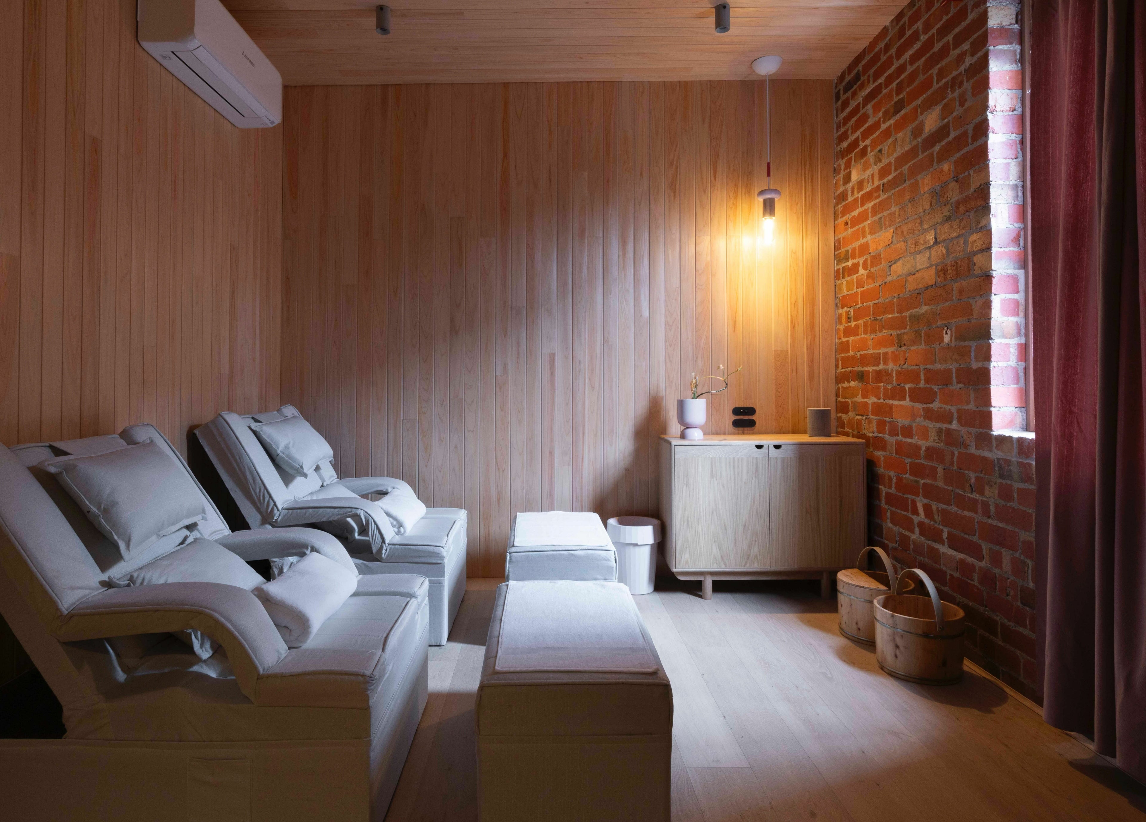 Relaxing spa chairs in warm light at In the Brick Spa, Melbourne, Victoria, AU. Perfect for unwinding.
