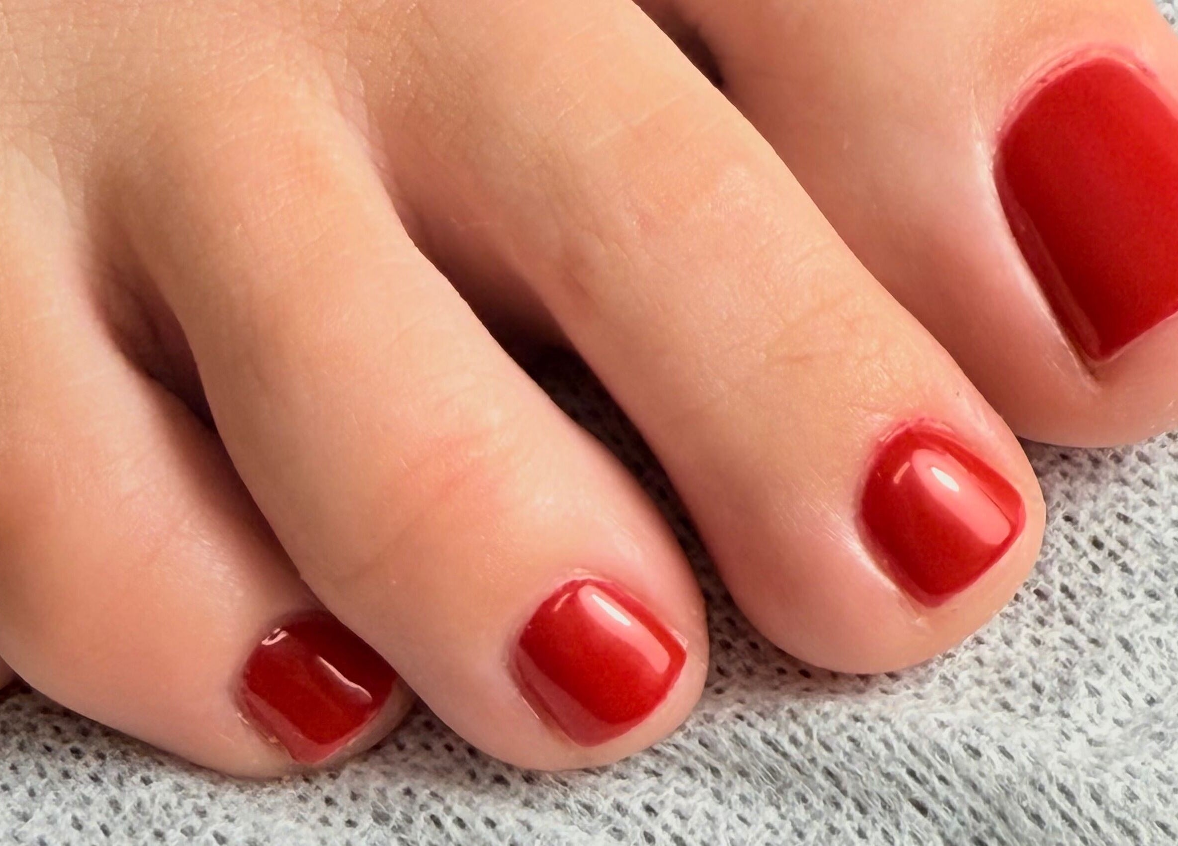 Close-up of vibrant red pedicure at Rianne’s Room (Elegance Studio), Ballygar, County Galway, IE.