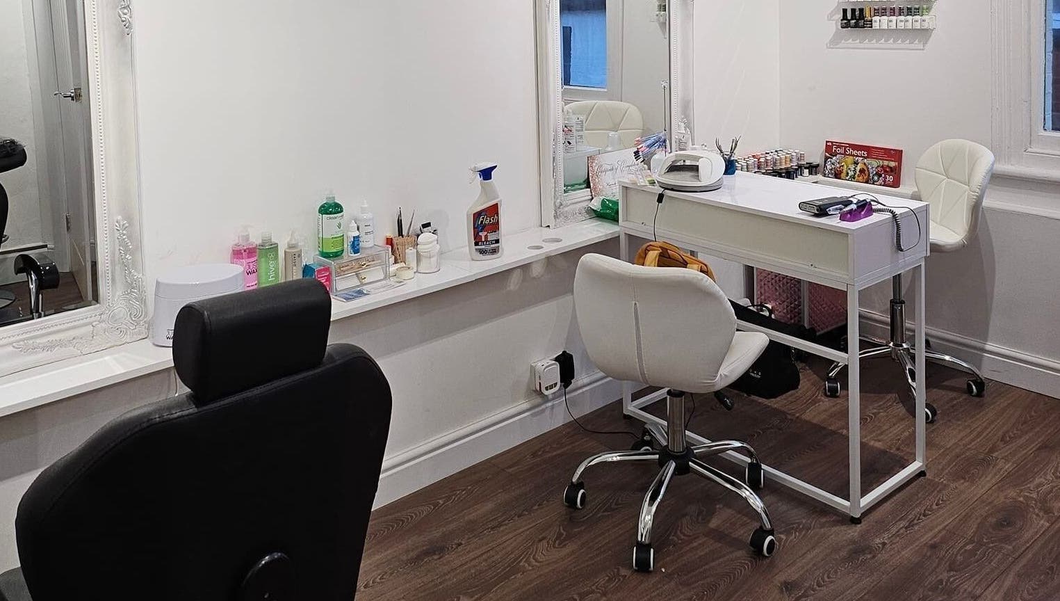 Elegant salon setup at Hannah's Be You Beauty in Norwich, England, GB, featuring modern chairs and beauty tools.