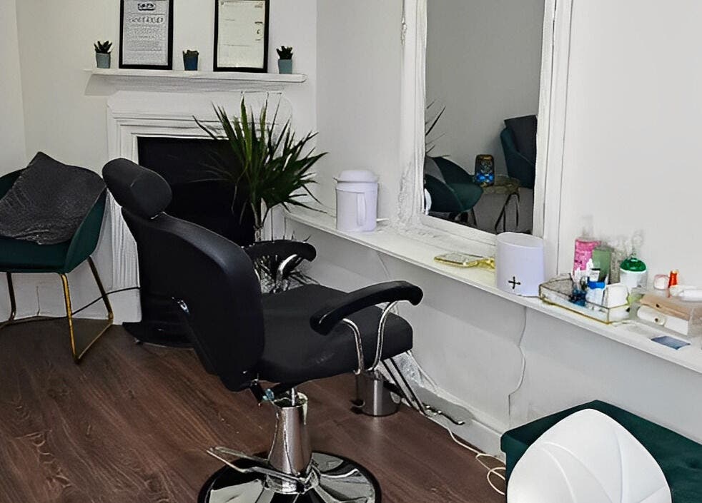 Modern salon chair and mirror at Hannah's Be You Beauty, Norwich, England, GB. Cozy and stylish interior.