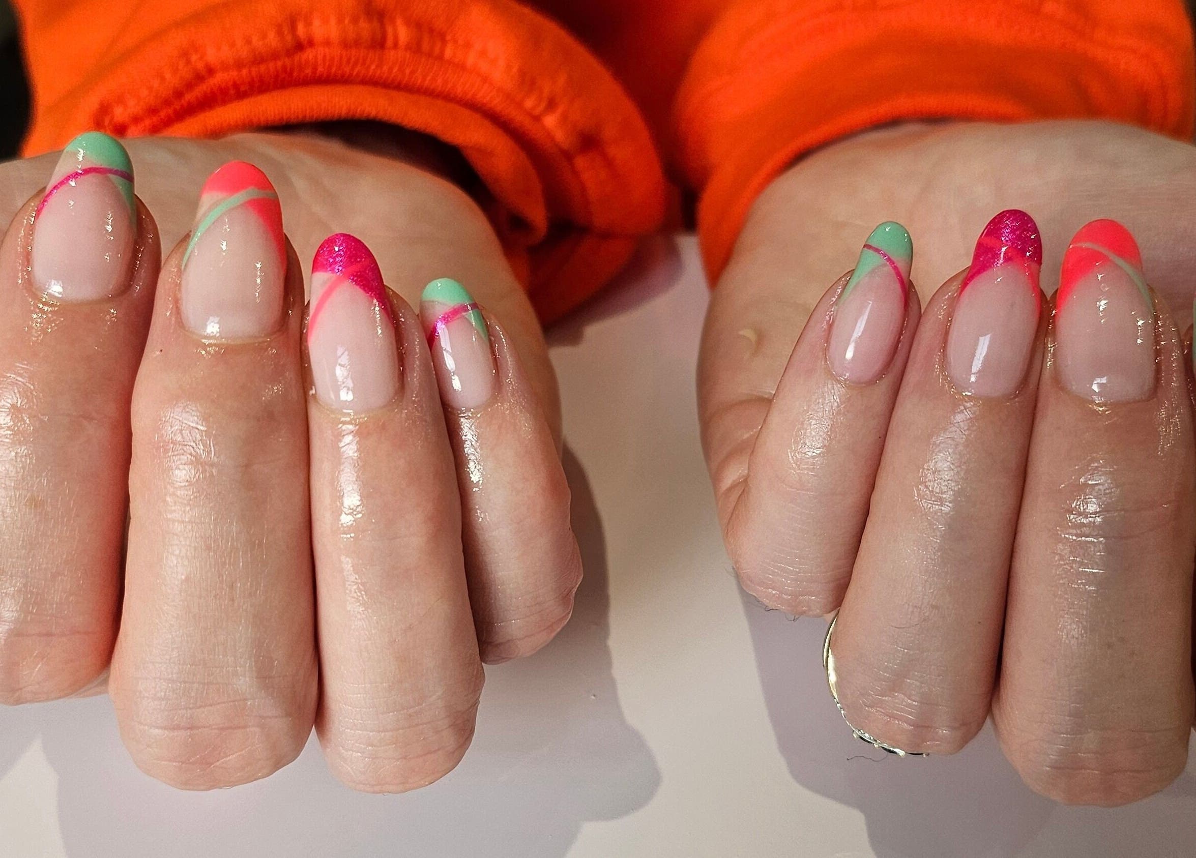 Colorful nail art at Hannah's Be You Beauty in Norwich, England, GB. Bright and stylish manicure design.