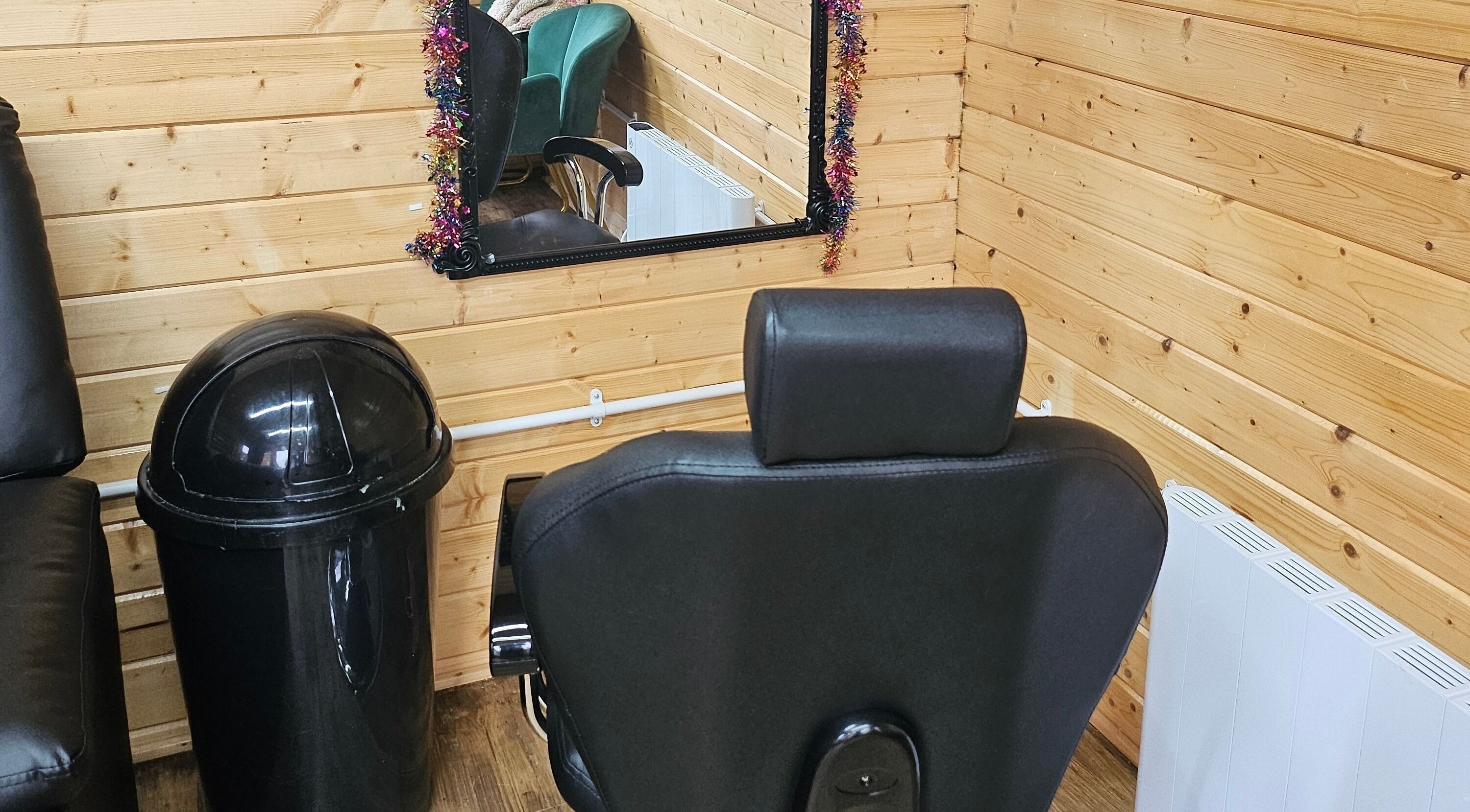 Cozy beauty salon corner at Hannah's Be You Beauty, Norwich, England, GB with stylish chair and mirror.