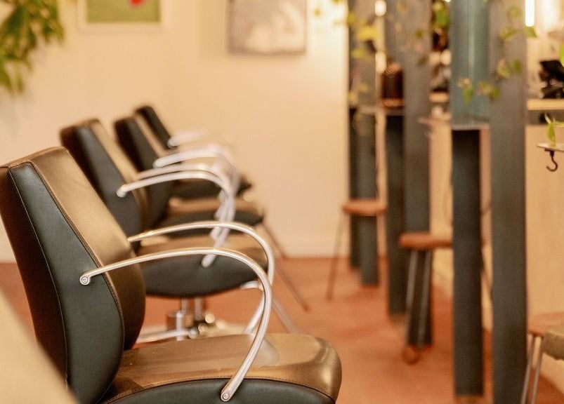 Elegant salon chairs at Lavender in Portland, Maine, US, offering a modern and relaxing ambiance.