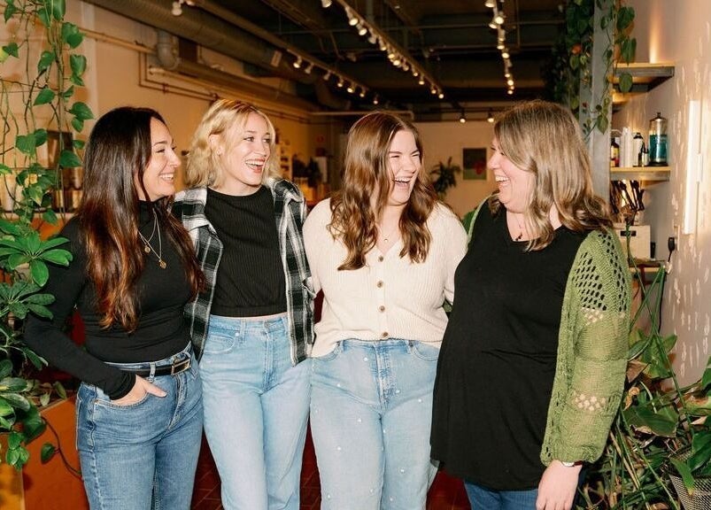Four friends laugh and enjoy the serene ambiance at Lavender, Portland, Maine, US.