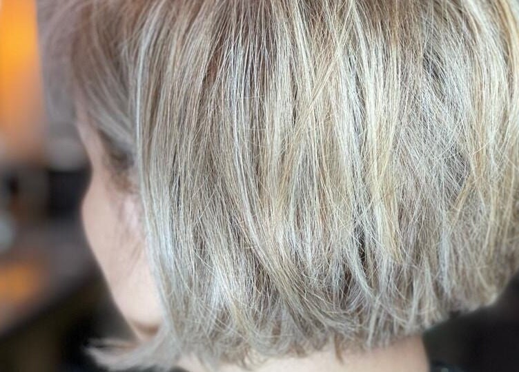 Stylish blonde bob haircut at Osama Kasir Beauty Salon and Barbershop, Dubai, AE.