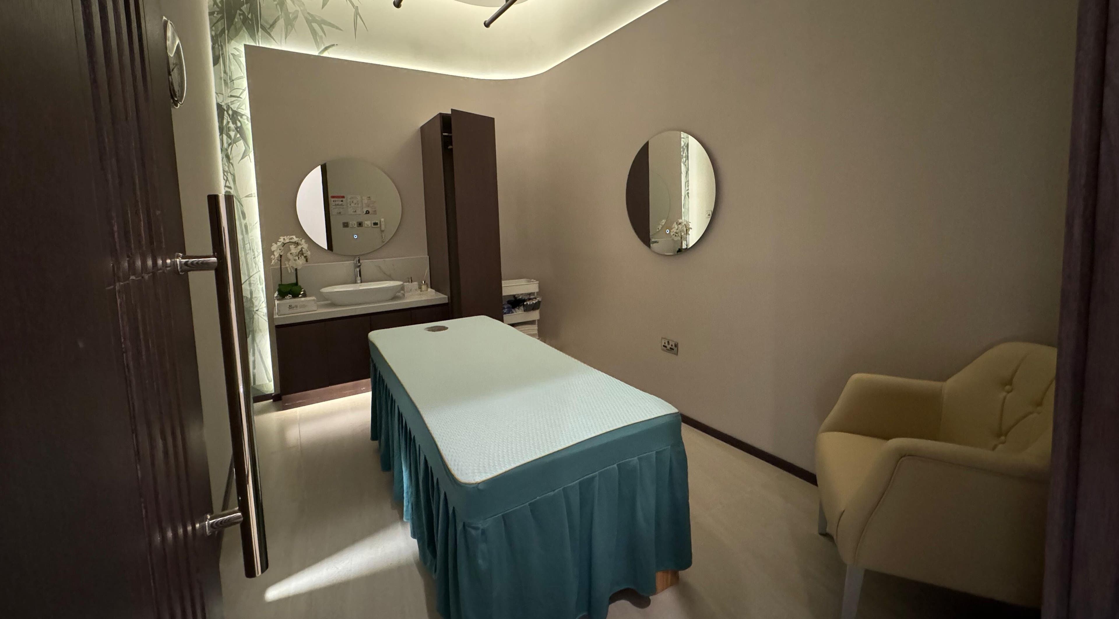 Relaxing spa treatment room at Yinyang Spa- The Galleria, Abu Dhabi, Al Maryah Island, AE, featuring modern decor.