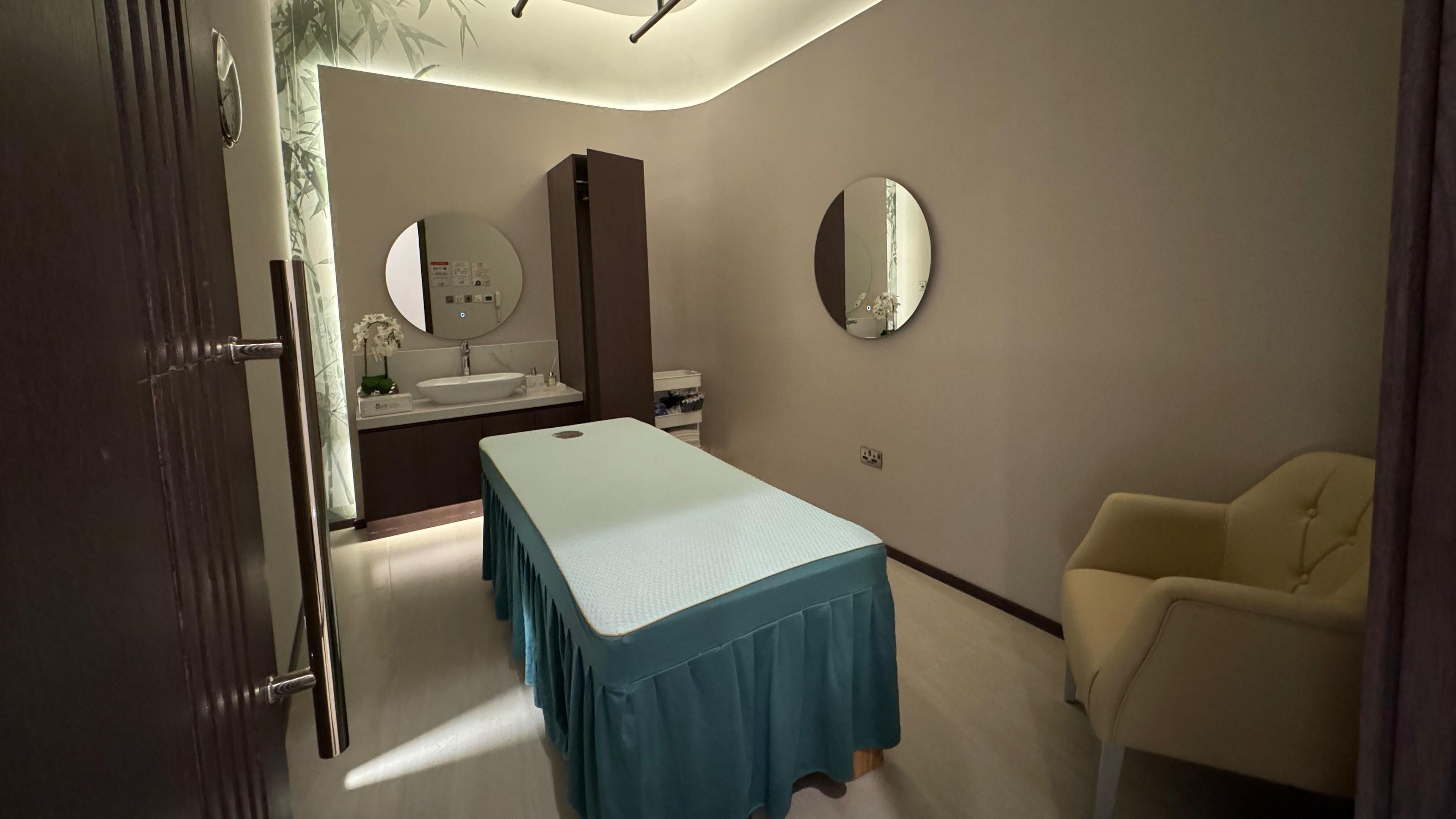 Relaxing spa treatment room at Yinyang Spa- The Galleria, Abu Dhabi, Al Maryah Island, AE, featuring modern decor.